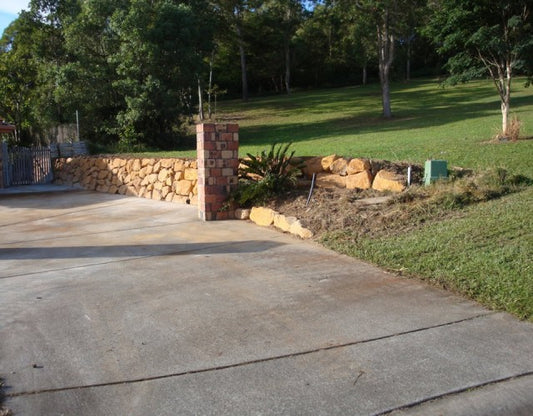 Durable Transformation: Bush Rock Boulder Wall in Gold Coast