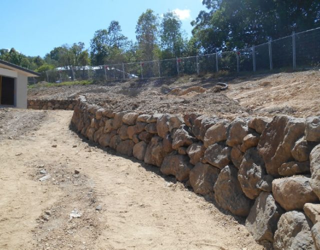 Bush Rock Retaining Wall Transformation in Upper Coomera, Gold Coast