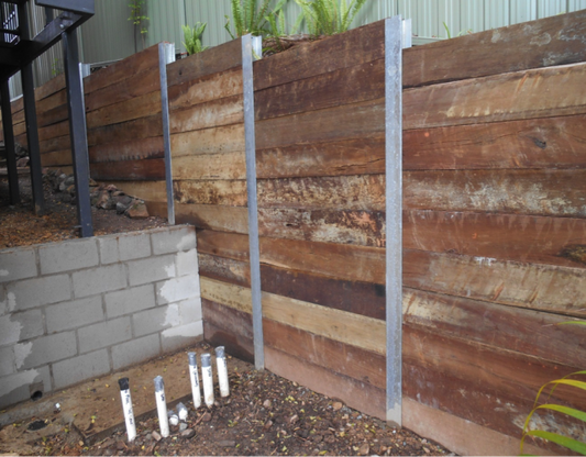 Robust Hardwood Sleeper Wall with H Beam Posts and Platypus Anchor System in Robina