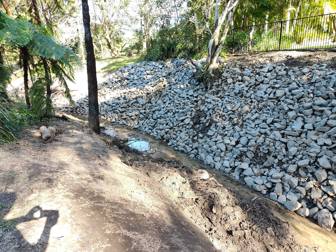 Rock Retaining Wall in Bonogin - Creek Embankment Erosion Control