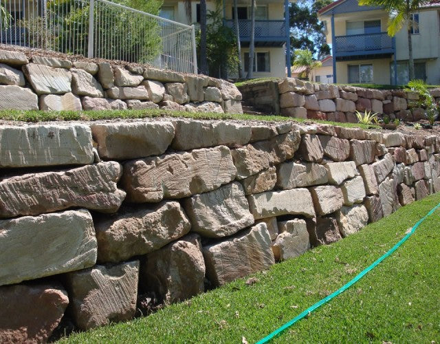 Sandstone Boulder Wall Installation for Unit Complex