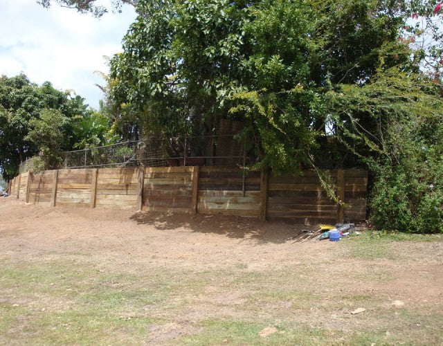 Treated Hardwood Sleeper Wall Installation in Gold Coast Park-Adjacent Property